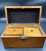 A mahogany tea caddy