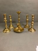 A selection of six brass candlesticks