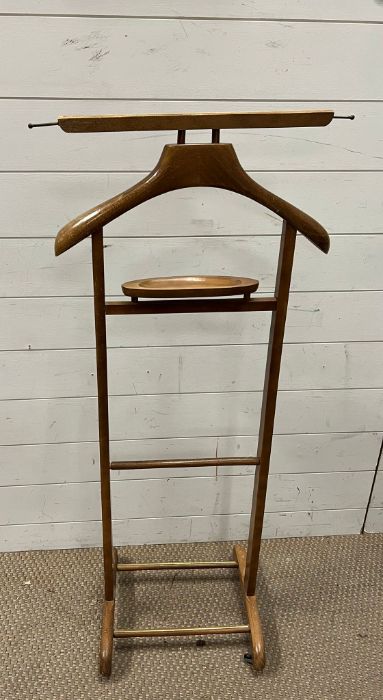 A wooden vintage clothes stand