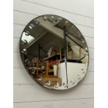 A circular wall mirror (Dia71cm)