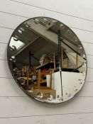 A circular wall mirror (Dia71cm)