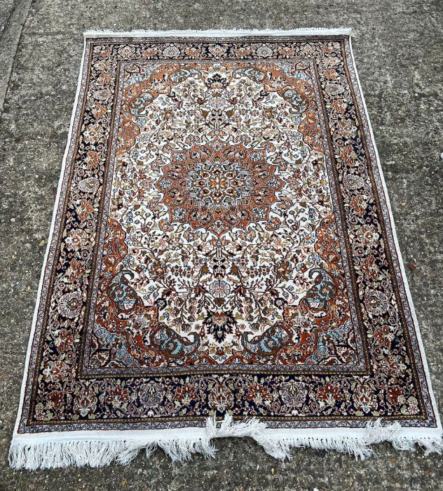 An Indian hand knotted silk rug