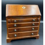 An apprentice bureau with hidden lock for draws.