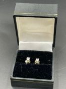 A Pair of diamond stud earrings