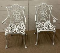 A pair of metal garden chairs