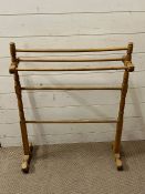 A turned pine towel rail