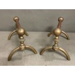 A pair of stylish late Victorian Aesthetic Movement brass firedogs by London metalworkers Benham and