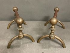 A pair of stylish late Victorian Aesthetic Movement brass firedogs by London metalworkers Benham and