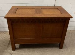 An oak coffer or blanket box with two panels front and lid (H60cm W86cm D44cm)