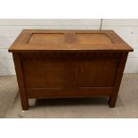 An oak coffer or blanket box with two panels front and lid (H60cm W86cm D44cm)