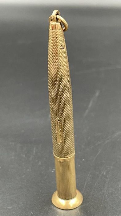A 9ct gold cigar piercer, hallmarked and with makers mark EB, total approximate weight 12.8g