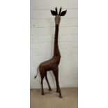 A metal giraffe sculpture (H163cm W50cm