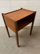 A teak bedside (H60cm W47cm D37cm)