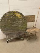 A vintage slatted garden table on metal frame on folding chair AF