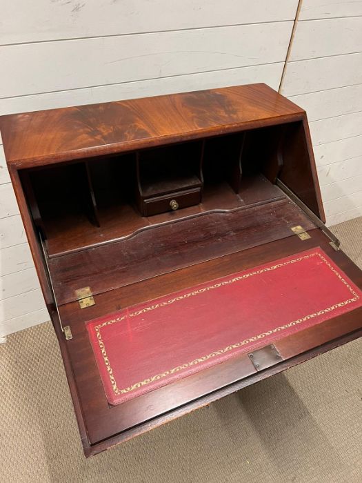 A mahogany bureau with fitted interior of pigeon holes and small drawers on bracket feet (H100cm - Image 4 of 5