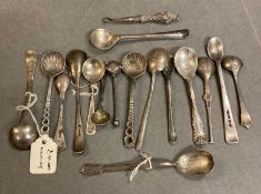 A large selection of silver mustard and salt spoons, various makers and hallmarks