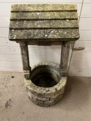 A weathered garden wishing well (H100cm W52cm)