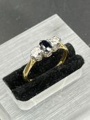 An 18ct yellow gold sapphire ring with diamond shoulders Size L1/2 (2.6g)