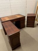 A pedestal desk with additional extension and separate filing cabinet