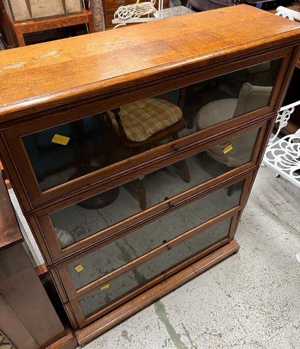 A set of four Globe Wernicke style book cases, can be made into two sets of two.