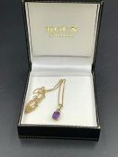 An amethyst and diamond pendant on 9ct gold and 9ct gold chain