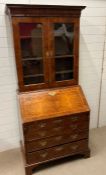 A burr walnut bureau bookcase, George I style opening to reveal drawers (W92cm D52cm H207cm)