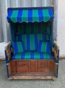 A bench/garden Cabana, recumbent model with pull out foot rest and drop down drinks tray