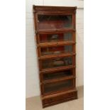 A rare eight section Globe Wernicke bookcase with moulded cornice top, six glazed sections, brass