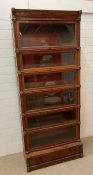 A rare eight section Globe Wernicke bookcase with moulded cornice top, six glazed sections, brass