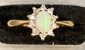 An Opal ring in an 18ct gold setting and mount. Approximate Size P