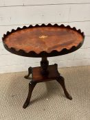 A pie crust edge side table on four down swept legs (H49cm Dia 45cm)