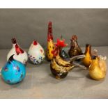 A selection of nine encased glass birds