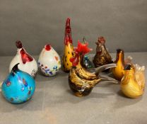 A selection of nine encased glass birds