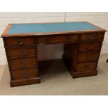 A pedestal desk with leather top (H78cm W137cm D60cm)