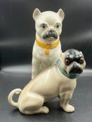 Two porcelain pugs, one stamped F and M