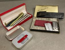 A selection of fountain pens, Ronson lighters and a Swiss army pen knife