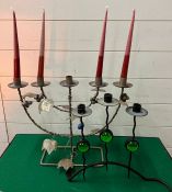 Five arm candle holder and a three arm candle holder in the style of Gunnar Ander