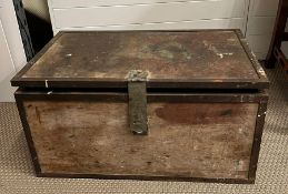 A wooden and metal bound trunk (H34cm W68cm D44cm)