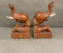 A pair of wooden elephant book ends