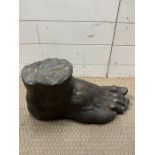 A bronzed foot