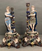 A pair of porcelain rococo style figural candle sticks (H53cm)