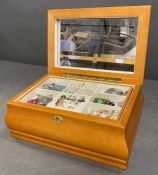 An inlaid wooden box containing an amount of costume jewellery