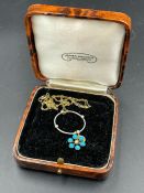 A Turquoise stone and seed pearl pendant 15ct gold (Approximate weight 2.5g) on a 9ct fine gold