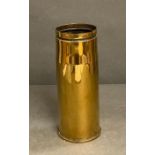 A polished brass shell casing