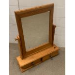 A Pine mirror with two drawers under