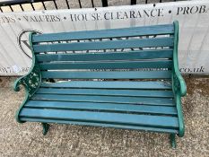 A Victorian style garden bench with cast iron ends