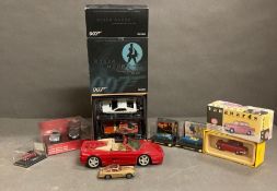 A selection of model cars to include the Corgi James Bond Aston Martin DB5 with working ejector seat