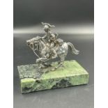 A Silver figurine of a mounted soldier, by maker EE &TH hallmarked for London and on a marble plinth