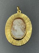 An 18ct gold cameo pendant, marked 750. Approximate total weight 9.6g