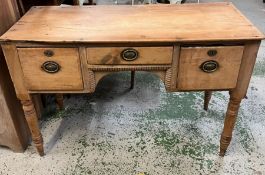 A vintage pine desk with turned legs and two deep drawers (H72cm W110cm D48cm)